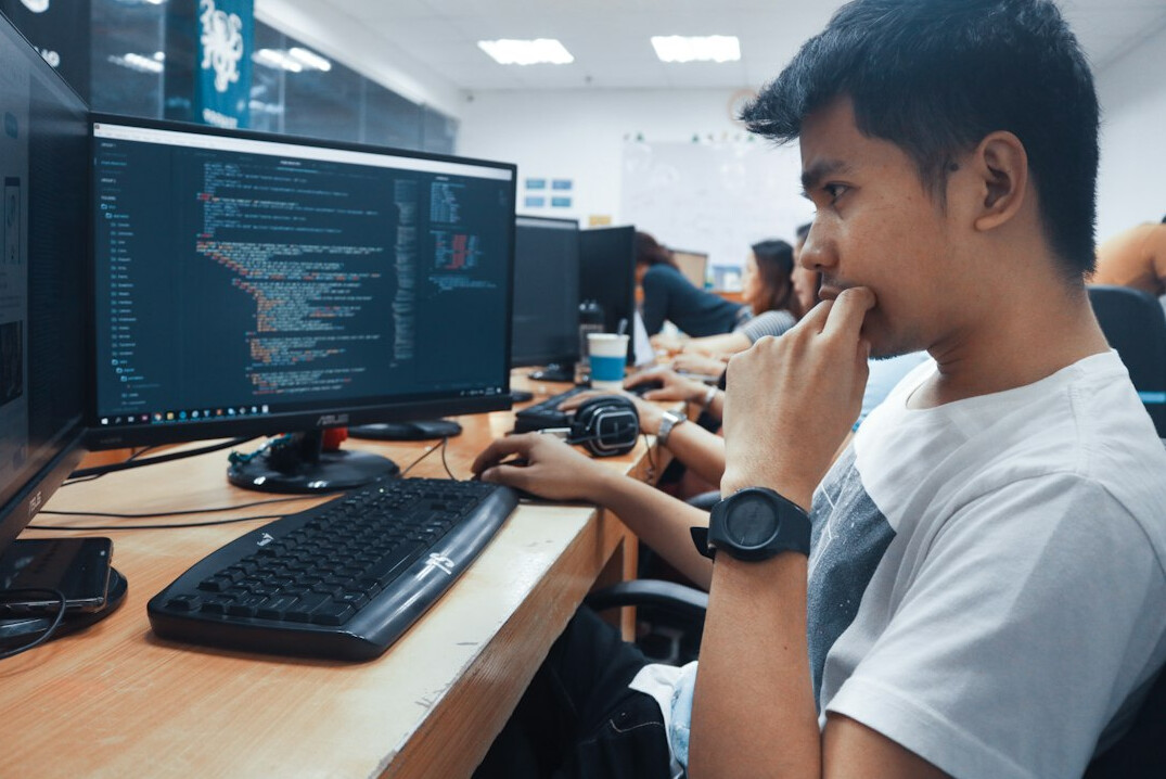 young person learning programming