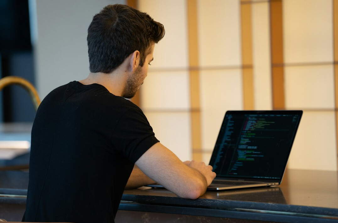 person learning coding on laptop
